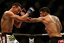 LAS VEGAS, NV - DECEMBER 29:  (R-L) Leonard Garcia punches Max Holloway during their featherweight fight at UFC 155 on December 29, 2012 at MGM Grand Garden Arena in Las Vegas, Nevada. (Photo by Josh Hedges/Zuffa LLC/Zuffa LLC via Getty Images) *** Local Caption *** Leonard Garcia; Max Holloway