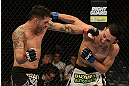 LAS VEGAS, NV - DECEMBER 29:  (L-R) Leonard Garcia punches Max Holloway during their featherweight fight at UFC 155 on December 29, 2012 at MGM Grand Garden Arena in Las Vegas, Nevada. (Photo by Donald Miralle/Zuffa LLC/Zuffa LLC via Getty Images) *** Local Caption *** Leonard Garcia; Max Holloway