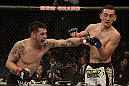 LAS VEGAS, NV - DECEMBER 29:  (L-R) Leonard Garcia punches Max Holloway during their featherweight fight at UFC 155 on December 29, 2012 at MGM Grand Garden Arena in Las Vegas, Nevada. (Photo by Donald Miralle/Zuffa LLC/Zuffa LLC via Getty Images) *** Local Caption *** Leonard Garcia; Max Holloway