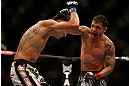 LAS VEGAS, NV - DECEMBER 29:  (R-L) Leonard Garcia punches Max Holloway during their featherweight fight at UFC 155 on December 29, 2012 at MGM Grand Garden Arena in Las Vegas, Nevada. (Photo by Josh Hedges/Zuffa LLC/Zuffa LLC via Getty Images) *** Local Caption *** Leonard Garcia; Max Holloway