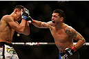 LAS VEGAS, NV - DECEMBER 29:  (R-L) Leonard Garcia punches Max Holloway during their featherweight fight at UFC 155 on December 29, 2012 at MGM Grand Garden Arena in Las Vegas, Nevada. (Photo by Josh Hedges/Zuffa LLC/Zuffa LLC via Getty Images) *** Local Caption *** Leonard Garcia; Max Holloway