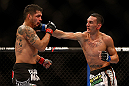LAS VEGAS, NV - DECEMBER 29:  (R-L) Max Holloway punches Leonard Garcia during their featherweight fight at UFC 155 on December 29, 2012 at MGM Grand Garden Arena in Las Vegas, Nevada. (Photo by Josh Hedges/Zuffa LLC/Zuffa LLC via Getty Images) *** Local Caption *** Leonard Garcia; Max Holloway