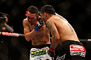 LAS VEGAS, NV - DECEMBER 29:  (R-L) Leonard Garcia punches Max Holloway during their featherweight fight at UFC 155 on December 29, 2012 at MGM Grand Garden Arena in Las Vegas, Nevada. (Photo by Josh Hedges/Zuffa LLC/Zuffa LLC via Getty Images) *** Local Caption *** Leonard Garcia; Max Holloway