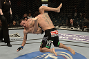 LAS VEGAS, NV - DECEMBER 29:  (R-L) Leonard Garcia slams Max Holloway during their featherweight fight at UFC 155 on December 29, 2012 at MGM Grand Garden Arena in Las Vegas, Nevada. (Photo by Donald Miralle/Zuffa LLC/Zuffa LLC via Getty Images) *** Local Caption *** Leonard Garcia; Max Holloway