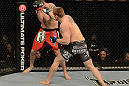LAS VEGAS, NV - DECEMBER 29:  (R-L) Todd Duffee punches Phil De Fries during their heavyweight fight at UFC 155 on December 29, 2012 at MGM Grand Garden Arena in Las Vegas, Nevada. (Photo by Donald Miralle/Zuffa LLC/Zuffa LLC via Getty Images) *** Local Caption *** Phil De Fries; Todd Duffee
