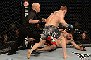LAS VEGAS, NV - DECEMBER 29:  Todd Duffee (gray shorts) attempts to finish Phil De Fries (red shorts) during their heavyweight fight at UFC 155 on December 29, 2012 at MGM Grand Garden Arena in Las Vegas, Nevada. (Photo by Donald Miralle/Zuffa LLC/Zuffa LLC via Getty Images) *** Local Caption *** Phil De Fries; Todd Duffee