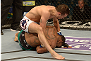 LAS VEGAS, NV - DECEMBER 29:  Myles Jury (top) punches Michael Johnson during their lightweight fight at UFC 155 on December 29, 2012 at MGM Grand Garden Arena in Las Vegas, Nevada. (Photo by Donald Miralle/Zuffa LLC/Zuffa LLC via Getty Images) *** Local Caption *** Michael Johnson; Myles Jury