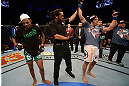 LAS VEGAS, NV - DECEMBER 29:  Myles Jury (right) is declared the winner in his fight against Michael Johnson (left) after their lightweight fight at UFC 155 on December 29, 2012 at MGM Grand Garden Arena in Las Vegas, Nevada. (Photo by Donald Miralle/Zuffa LLC/Zuffa LLC via Getty Images) *** Local Caption *** Michael Johnson; Myles Jury