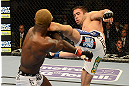 LAS VEGAS, NV - DECEMBER 29:  (R-L) Jamie Varner kicks Melvin Guillard during their lightweight fight at UFC 155 on December 29, 2012 at MGM Grand Garden Arena in Las Vegas, Nevada. (Photo by Donald Miralle/Zuffa LLC/Zuffa LLC via Getty Images) *** Local Caption *** Melvin Guillard; Jamie Varner
