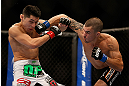 LAS VEGAS, NV - DECEMBER 29:  Byron Bloodworth (right) punches Erik Perez during their bantamweight fight at UFC 155 on December 29, 2012 at MGM Grand Garden Arena in Las Vegas, Nevada. (Photo by Josh Hedges/Zuffa LLC/Zuffa LLC via Getty Images) *** Local Caption *** Erik Perez; Byron Bloodworth