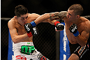 LAS VEGAS, NV - DECEMBER 29:  Byron Bloodworth (right) punches Erik Perez during their bantamweight fight at UFC 155 on December 29, 2012 at MGM Grand Garden Arena in Las Vegas, Nevada. (Photo by Josh Hedges/Zuffa LLC/Zuffa LLC via Getty Images) *** Local Caption *** Erik Perez; Byron Bloodworth
