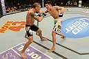 LAS VEGAS, NV - DECEMBER 29:  Erik Perez (right) punches Byron Bloodworth during their bantamweight fight at UFC 155 on December 29, 2012 at MGM Grand Garden Arena in Las Vegas, Nevada. (Photo by Donald Miralle/Zuffa LLC/Zuffa LLC via Getty Images) *** Local Caption *** Erik Perez; Byron Bloodworth