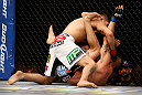 LAS VEGAS, NV - DECEMBER 29:  Erik Perez (white shorts) punches Byron Bloodworth during their bantamweight fight at UFC 155 on December 29, 2012 at MGM Grand Garden Arena in Las Vegas, Nevada. (Photo by Josh Hedges/Zuffa LLC/Zuffa LLC via Getty Images) *** Local Caption *** Erik Perez; Byron Bloodworth