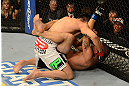 LAS VEGAS, NV - DECEMBER 29:  Erik Perez (top) punches Byron Bloodworth during their bantamweight fight at UFC 155 on December 29, 2012 at MGM Grand Garden Arena in Las Vegas, Nevada. (Photo by Donald Miralle/Zuffa LLC/Zuffa LLC via Getty Images) *** Local Caption *** Erik Perez; Byron Bloodworth