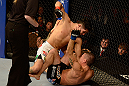 LAS VEGAS, NV - DECEMBER 29:  Erik Perez (top) punches Byron Bloodworth during their bantamweight fight at UFC 155 on December 29, 2012 at MGM Grand Garden Arena in Las Vegas, Nevada. (Photo by Donald Miralle/Zuffa LLC/Zuffa LLC via Getty Images) *** Local Caption *** Erik Perez; Byron Bloodworth