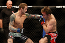 LAS VEGAS, NV - DECEMBER 29:  (L-R) Eddie Wineland punches Brad Pickett during their bantamweight fight at UFC 155 on December 29, 2012 at MGM Grand Garden Arena in Las Vegas, Nevada. (Photo by Josh Hedges/Zuffa LLC/Zuffa LLC via Getty Images) *** Local Caption *** Brad Pickett; Eddie Wineland