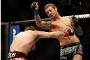 LAS VEGAS, NV - DECEMBER 29:  (R-L) Eddie Wineland punches Brad Pickett during their bantamweight fight at UFC 155 on December 29, 2012 at MGM Grand Garden Arena in Las Vegas, Nevada. (Photo by Josh Hedges/Zuffa LLC/Zuffa LLC via Getty Images) *** Local Caption *** Brad Pickett; Eddie Wineland