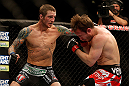 LAS VEGAS, NV - DECEMBER 29:  (L-R) Eddie Wineland punches Brad Pickett during their bantamweight fight at UFC 155 on December 29, 2012 at MGM Grand Garden Arena in Las Vegas, Nevada. (Photo by Josh Hedges/Zuffa LLC/Zuffa LLC via Getty Images) *** Local Caption *** Brad Pickett; Eddie Wineland