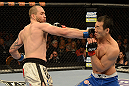 LAS VEGAS, NV - DECEMBER 29:  (L-R) Alan Belcher punches Yushin Okami during their middleweight fight at UFC 155 on December 29, 2012 at MGM Grand Garden Arena in Las Vegas, Nevada. (Photo by Donald Miralle/Zuffa LLC/Zuffa LLC via Getty Images) *** Local Caption *** Yushin Okami; Alan Belcher
