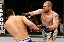 LAS VEGAS, NV - DECEMBER 29:  (R-L) Alan Belcher punches Yushin Okami during their middleweight fight at UFC 155 on December 29, 2012 at MGM Grand Garden Arena in Las Vegas, Nevada. (Photo by Josh Hedges/Zuffa LLC/Zuffa LLC via Getty Images) *** Local Caption *** Yushin Okami; Alan Belcher