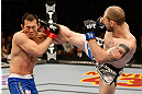 LAS VEGAS, NV - DECEMBER 29:  (R-L) Alan Belcher kicks Yushin Okami during their middleweight fight at UFC 155 on December 29, 2012 at MGM Grand Garden Arena in Las Vegas, Nevada. (Photo by Josh Hedges/Zuffa LLC/Zuffa LLC via Getty Images) *** Local Caption *** Yushin Okami; Alan Belcher