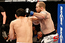 LAS VEGAS, NV - DECEMBER 29:  (L-R) Yushin Okami punches Alan Belcher during their middleweight fight at UFC 155 on December 29, 2012 at MGM Grand Garden Arena in Las Vegas, Nevada. (Photo by Josh Hedges/Zuffa LLC/Zuffa LLC via Getty Images) *** Local Caption *** Yushin Okami; Alan Belcher