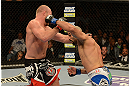 LAS VEGAS, NV - DECEMBER 29:  (R-L) Constantinos Philippou punches Tim Boetsch during their middleweight fight at UFC 155 on December 29, 2012 at MGM Grand Garden Arena in Las Vegas, Nevada. (Photo by Donald Miralle/Zuffa LLC/Zuffa LLC via Getty Images) *** Local Caption *** Tim Boetsch; Constantinos Philippou