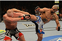 LAS VEGAS, NV - DECEMBER 29:  (R-L) Constantinos Philippou kicks Tim Boetsch during their middleweight fight at UFC 155 on December 29, 2012 at MGM Grand Garden Arena in Las Vegas, Nevada. (Photo by Donald Miralle/Zuffa LLC/Zuffa LLC via Getty Images) *** Local Caption *** Tim Boetsch; Constantinos Philippou