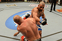 LAS VEGAS, NV - DECEMBER 29:  Constantinos Philippou (top) punches Tim Boetsch during their middleweight fight at UFC 155 on December 29, 2012 at MGM Grand Garden Arena in Las Vegas, Nevada. (Photo by Donald Miralle/Zuffa LLC/Zuffa LLC via Getty Images) *** Local Caption *** Tim Boetsch; Constantinos Philippou
