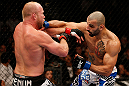 LAS VEGAS, NV - DECEMBER 29:  (R-L) Constantinos Philippou punches Tim Boetsch during their middleweight fight at UFC 155 on December 29, 2012 at MGM Grand Garden Arena in Las Vegas, Nevada. (Photo by Josh Hedges/Zuffa LLC/Zuffa LLC via Getty Images) *** Local Caption *** Tim Boetsch; Constantinos Philippou