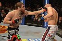 LAS VEGAS, NV - DECEMBER 29:  (L-R) Jim Miller punches Joe Lauzon during their lightweight fight at UFC 155 on December 29, 2012 at MGM Grand Garden Arena in Las Vegas, Nevada. (Photo by Donald Miralle/Zuffa LLC/Zuffa LLC via Getty Images) *** Local Caption *** Joe Lauzon; Jim Miller
