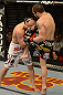 LAS VEGAS, NV - DECEMBER 29:  (R-L) Jim Miller knees Joe Lauzon during their lightweight fight at UFC 155 on December 29, 2012 at MGM Grand Garden Arena in Las Vegas, Nevada. (Photo by Donald Miralle/Zuffa LLC/Zuffa LLC via Getty Images) *** Local Caption *** Joe Lauzon; Jim Miller
