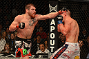 LAS VEGAS, NV - DECEMBER 29:  (L-R) Jim Miller punches Joe Lauzon during their lightweight fight at UFC 155 on December 29, 2012 at MGM Grand Garden Arena in Las Vegas, Nevada. (Photo by Donald Miralle/Zuffa LLC/Zuffa LLC via Getty Images) *** Local Caption *** Joe Lauzon; Jim Miller