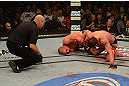 LAS VEGAS, NV - DECEMBER 29:  Joe Lauzon (center) attempts to submit Jim Miller (right) as referee Yves Lavigne looks on during their lightweight fight at UFC 155 on December 29, 2012 at MGM Grand Garden Arena in Las Vegas, Nevada. (Photo by Donald Miralle/Zuffa LLC/Zuffa LLC via Getty Images) *** Local Caption *** Joe Lauzon; Jim Miller