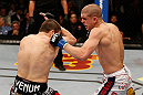LAS VEGAS, NV - DECEMBER 29:  (R-L) Joe Lauzon punches Jim Miller during their lightweight fight at UFC 155 on December 29, 2012 at MGM Grand Garden Arena in Las Vegas, Nevada. (Photo by Josh Hedges/Zuffa LLC/Zuffa LLC via Getty Images) *** Local Caption *** Joe Lauzon; Jim Miller