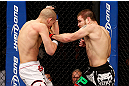 LAS VEGAS, NV - DECEMBER 29:  (R-L) Jim Miller punches Joe Lauzon during their lightweight fight at UFC 155 on December 29, 2012 at MGM Grand Garden Arena in Las Vegas, Nevada. (Photo by Josh Hedges/Zuffa LLC/Zuffa LLC via Getty Images) *** Local Caption *** Joe Lauzon; Jim Miller