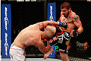 LAS VEGAS, NV - DECEMBER 29:  (R-L) Jim Miller knees Joe Lauzon during their lightweight fight at UFC 155 on December 29, 2012 at MGM Grand Garden Arena in Las Vegas, Nevada. (Photo by Josh Hedges/Zuffa LLC/Zuffa LLC via Getty Images) *** Local Caption *** Joe Lauzon; Jim Miller