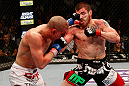 LAS VEGAS, NV - DECEMBER 29:  (R-L) Jim Miller punches Joe Lauzon during their lightweight fight at UFC 155 on December 29, 2012 at MGM Grand Garden Arena in Las Vegas, Nevada. (Photo by Josh Hedges/Zuffa LLC/Zuffa LLC via Getty Images) *** Local Caption *** Joe Lauzon; Jim Miller