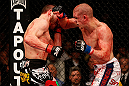 LAS VEGAS, NV - DECEMBER 29:  (R-L) Joe Lauzon punches Jim Miller during their lightweight fight at UFC 155 on December 29, 2012 at MGM Grand Garden Arena in Las Vegas, Nevada. (Photo by Josh Hedges/Zuffa LLC/Zuffa LLC via Getty Images) *** Local Caption *** Joe Lauzon; Jim Miller