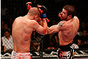 LAS VEGAS, NV - DECEMBER 29:  (R-L) Jim Miller punches Joe Lauzon during their lightweight fight at UFC 155 on December 29, 2012 at MGM Grand Garden Arena in Las Vegas, Nevada. (Photo by Josh Hedges/Zuffa LLC/Zuffa LLC via Getty Images) *** Local Caption *** Joe Lauzon; Jim Miller