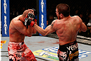 LAS VEGAS, NV - DECEMBER 29:  (R-L) Jim Miller punches Joe Lauzon during their lightweight fight at UFC 155 on December 29, 2012 at MGM Grand Garden Arena in Las Vegas, Nevada. (Photo by Josh Hedges/Zuffa LLC/Zuffa LLC via Getty Images) *** Local Caption *** Joe Lauzon; Jim Miller