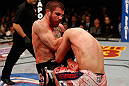 LAS VEGAS, NV - DECEMBER 29:  (L-R) Jim Miller knees Joe Lauzon during their lightweight fight at UFC 155 on December 29, 2012 at MGM Grand Garden Arena in Las Vegas, Nevada. (Photo by Josh Hedges/Zuffa LLC/Zuffa LLC via Getty Images) *** Local Caption *** Joe Lauzon; Jim Miller