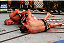 LAS VEGAS, NV - DECEMBER 29:  Joe Lauzon (left) attempts to submit Jim Miller during their lightweight fight at UFC 155 on December 29, 2012 at MGM Grand Garden Arena in Las Vegas, Nevada. (Photo by Josh Hedges/Zuffa LLC/Zuffa LLC via Getty Images) *** Local Caption *** Joe Lauzon; Jim Miller