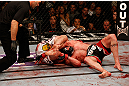 LAS VEGAS, NV - DECEMBER 29:  Joe Lauzon (left) attempts to submit Jim Miller during their lightweight fight at UFC 155 on December 29, 2012 at MGM Grand Garden Arena in Las Vegas, Nevada. (Photo by Josh Hedges/Zuffa LLC/Zuffa LLC via Getty Images) *** Local Caption *** Joe Lauzon; Jim Miller