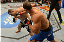 LAS VEGAS, NV - DECEMBER 29:  (R-L) Junior dos Santos punches Cain Velasquez during their heavyweight championship fight at UFC 155 on December 29, 2012 at MGM Grand Garden Arena in Las Vegas, Nevada. (Photo by Donald Miralle/Zuffa LLC/Zuffa LLC via Getty Images) *** Local Caption *** Junior dos Santos; Cain Velasquez