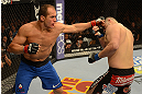 LAS VEGAS, NV - DECEMBER 29:  (L-R) Junior dos Santos punches Cain Velasquez during their heavyweight championship fight at UFC 155 on December 29, 2012 at MGM Grand Garden Arena in Las Vegas, Nevada. (Photo by Donald Miralle/Zuffa LLC/Zuffa LLC via Getty Images) *** Local Caption *** Junior dos Santos; Cain Velasquez
