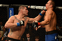 LAS VEGAS, NV - DECEMBER 29:  (L-R) Cain Velasquez punches Junior dos Santos during their heavyweight championship fight at UFC 155 on December 29, 2012 at MGM Grand Garden Arena in Las Vegas, Nevada. (Photo by Donald Miralle/Zuffa LLC/Zuffa LLC via Getty Images) *** Local Caption *** Junior dos Santos; Cain Velasquez