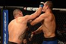 LAS VEGAS, NV - DECEMBER 29:  (L-R) Cain Velasquez punches Junior dos Santos during their heavyweight championship fight at UFC 155 on December 29, 2012 at MGM Grand Garden Arena in Las Vegas, Nevada. (Photo by Donald Miralle/Zuffa LLC/Zuffa LLC via Getty Images) *** Local Caption *** Junior dos Santos; Cain Velasquez