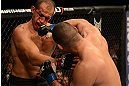 LAS VEGAS, NV - DECEMBER 29:  (R-L) Cain Velasquez punches Junior dos Santos during their heavyweight championship fight at UFC 155 on December 29, 2012 at MGM Grand Garden Arena in Las Vegas, Nevada. (Photo by Donald Miralle/Zuffa LLC/Zuffa LLC via Getty Images) *** Local Caption *** Junior dos Santos; Cain Velasquez