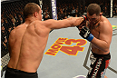 LAS VEGAS, NV - DECEMBER 29:  (L-R) Junior dos Santos punches Cain Velasquez during their heavyweight championship fight at UFC 155 on December 29, 2012 at MGM Grand Garden Arena in Las Vegas, Nevada. (Photo by Donald Miralle/Zuffa LLC/Zuffa LLC via Getty Images) *** Local Caption *** Junior dos Santos; Cain Velasquez